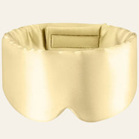 Masque de sommeil en soie beige, présenté de face sur fond clair.
